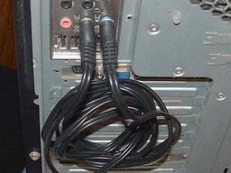 picture of a loop-back cable plugged in to the back of a computer